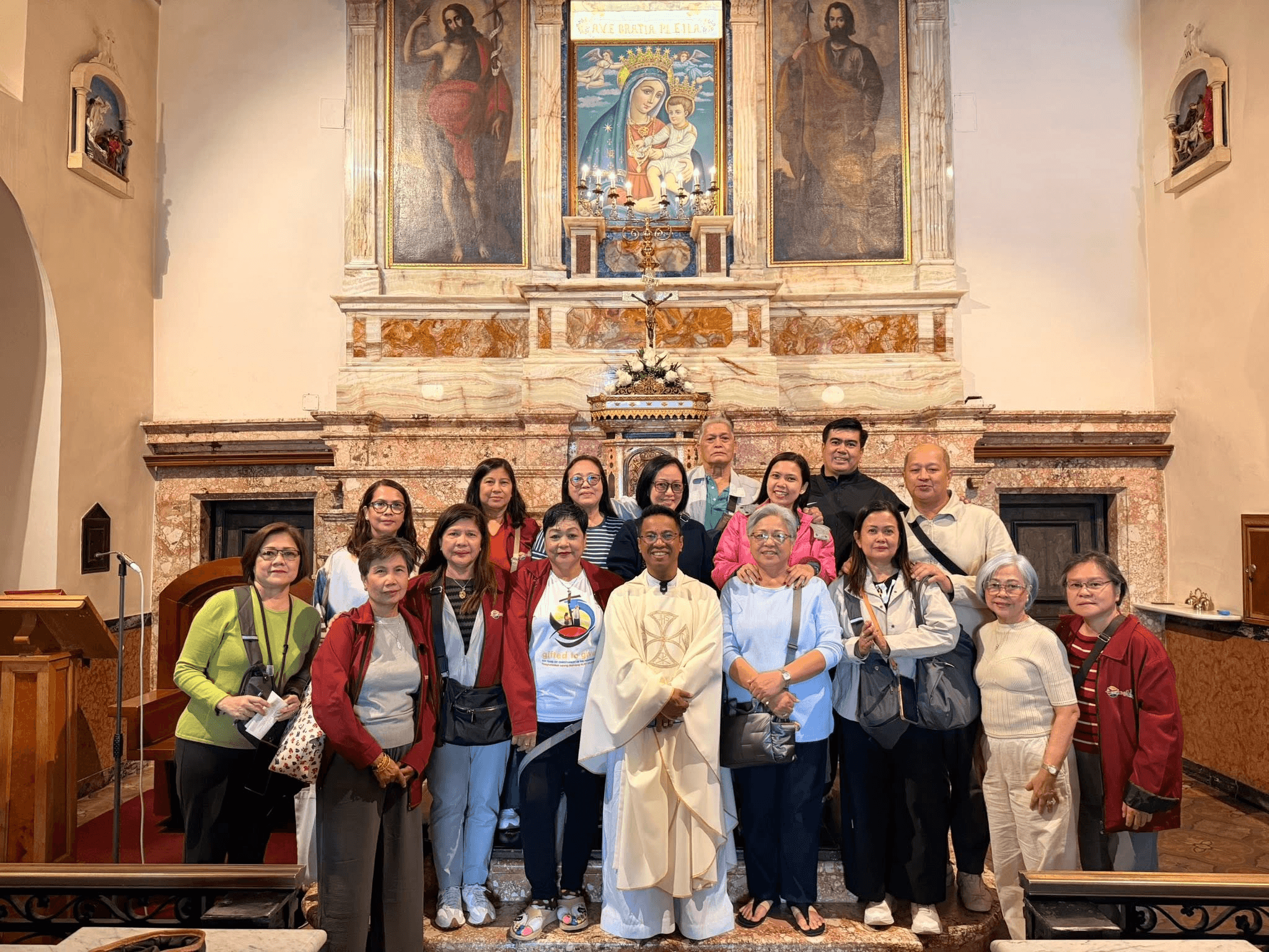 Pilgrimage group outside a church